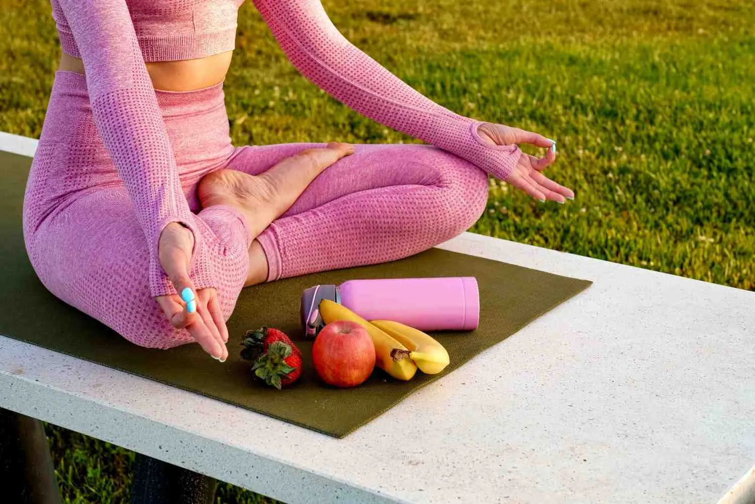 Person sitting on a wooden floor with a bowl of fruit, a skipping rope and a scale nearby